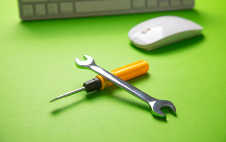 Wrench and screwdriver with a computer keyboard. IT Service. Supportの写真素材
