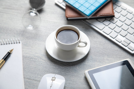 Notepad, pen, with a different business objects on the table.の写真素材