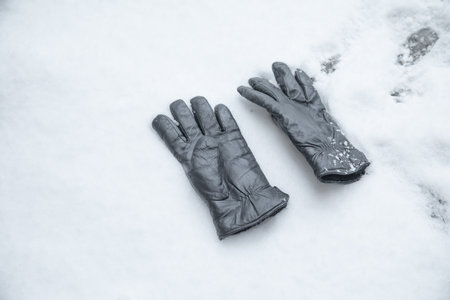 Winter leather gloves on the snow.の写真素材