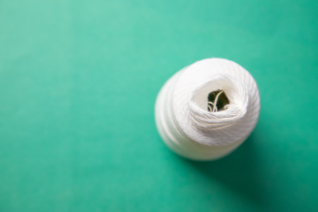Close up of spool of white thread.の写真素材