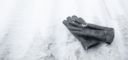 Winter leather gloves on the snow.の写真素材