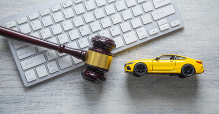 Computer keyboard, toy car and judge gavel.