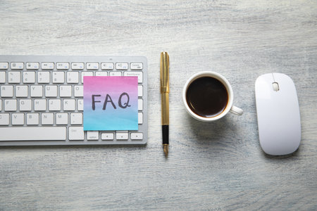 Faq message written on sticky note.の写真素材