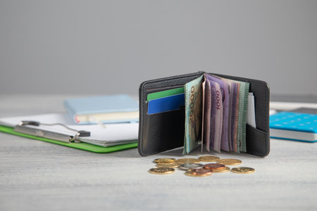 Wallet with a coins on the table. Finance