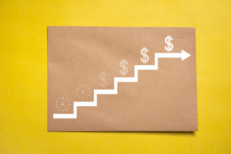 Time is money concept. Clock and dollar on a stairsの写真素材