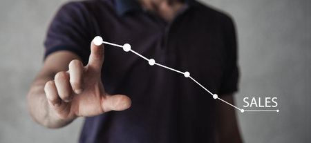 Sales word with a decrease chart. Financial crisisの写真素材