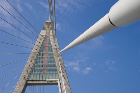 Bridge pylon and rope wires, irregular view.