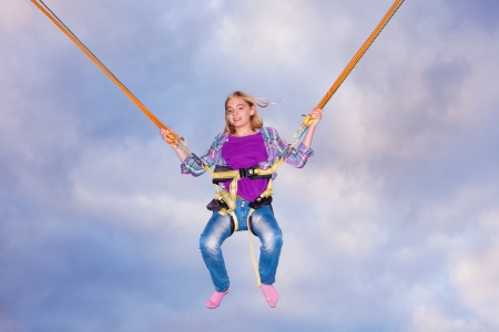 Young girl In Trampoline Jumping Ropeの写真素材