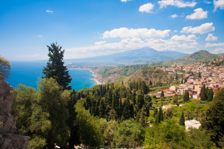 Taormina with the sea and the Etna in the back in italy.の写真素材
