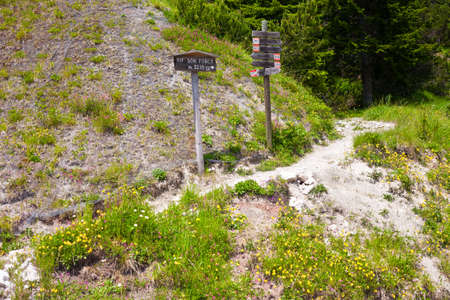 Tourist pathway with sign posts in the Dolomites, Italyの写真素材
