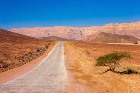 Road running through Timna Park in the Negev Desert near to Eilat in Israel.の写真素材