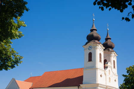 Detail of the Tihany abbey framed by foliageの写真素材