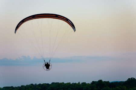 Paraglidign after sunsetの写真素材