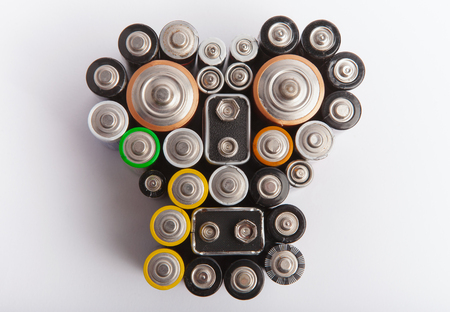 Skull shape made from various used batteries - Environmental pollution conceptの写真素材