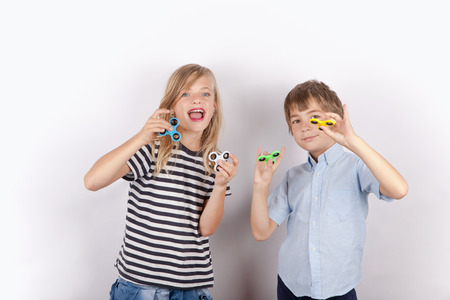 Kids posing with their fidget spinnersの写真素材