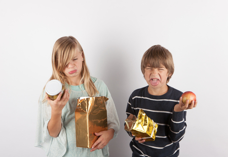 Children shocked by bad gifts.の写真素材
