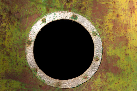 Colorful rusty steel plate with a black hole windowの写真素材