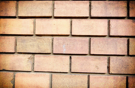 Vignetted red brick wall for bacgrounds