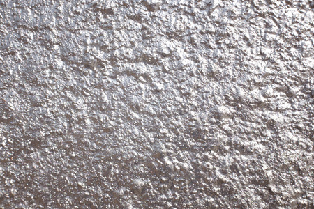 Silver metallic painted grunge wall for backgrounds