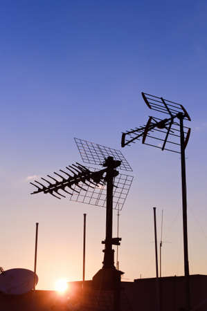 Archaic outdoor antennas silhouette at sunsetの写真素材