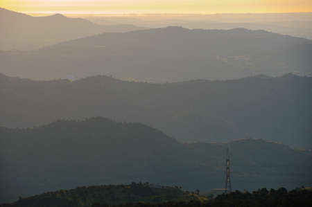 Tranquil twilight landscape. Hills and trees in a hazeの写真素材