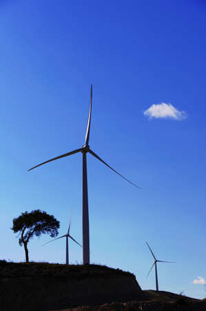 Huge windmill station with blue sky background
