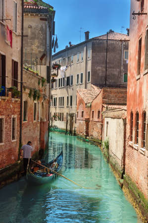 Beautiful venetian street in summer day,in  Italyの写真素材