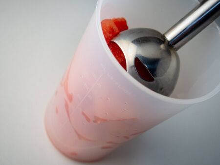 Roads of fresh watermelon in a bowl with a blender. Cooking fresh delicious watermelon smoothie.の写真素材