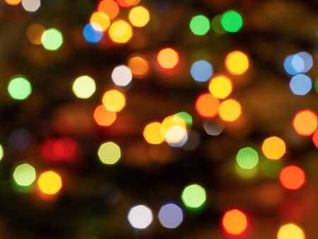 Christmas light background. Holiday glowing backdrop. Defocused Background. Blurred Bokeh.の写真素材