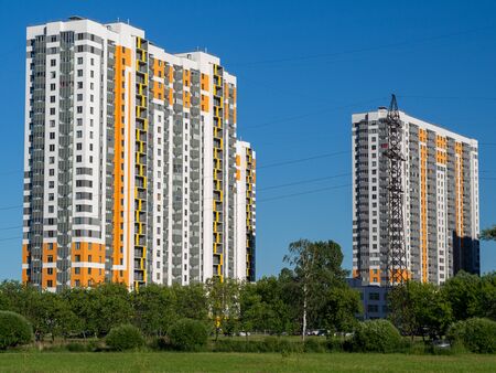 New quarters. Multi-story  building on a background of blue sky.の写真素材
