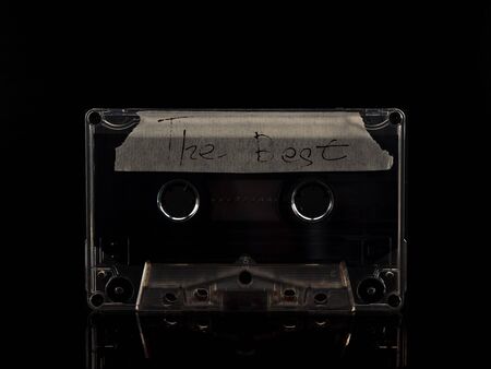 Old audio cassette on a black background. vintageの写真素材