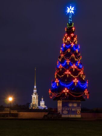 ST-PETERSBURG, RUSSIA - 03.01.2020: Christmas decorations of the Russian city, January 3, 2020. Christmas tree on the spit of Vasilievsky Island. New Year's Eve street design with night lighting.のeditorial素材