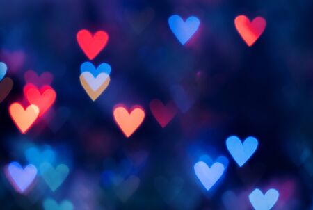 red hearts bokeh as background.の写真素材