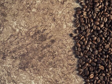 Coffee beans in a bag on a woodenの写真素材