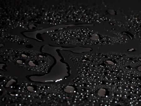 Water drops on black backgroundの写真素材