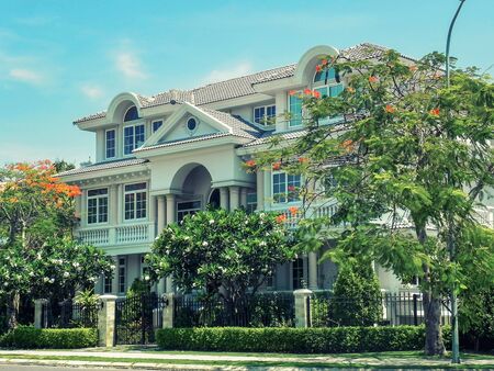 One beautiful three-story house with  trees, and landscape design in the summer. An Vien. Nha trang. Vietna.の写真素材