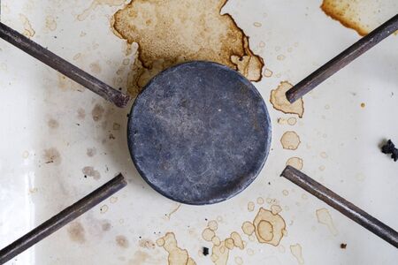 Very dirty, covered with grease one ring stove gas stove in the kitchenの写真素材