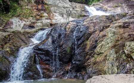 Motion Blur Waterfalls Peaceful Nature Landscape in Blue Ridge Mountains with lush green trees, rocks and flowing waterの写真素材