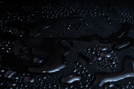 Water drops on black backgroundの写真素材