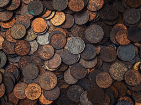 Background of old coins in low key. Old Russian coins, rubles and pennies.