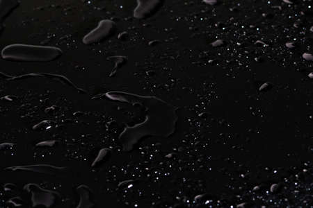 Water drops on black backgroundの写真素材