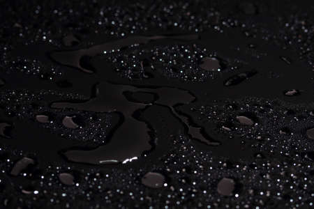 Water drops on black backgroundの写真素材