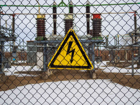 high voltage warning sign on high-voltage substationの写真素材