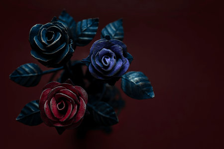 Three multicolored roses, made of metal forging.の写真素材