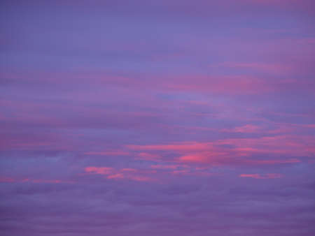Abstract nature background. Dramatic and moody pink, purple and blue cloudy sunset skyの写真素材