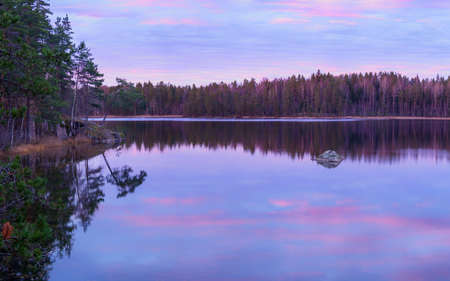 pretty sunrise on the beauty forest lakeの写真素材