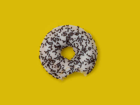 Colorful delicious donut in a row, bittenの写真素材