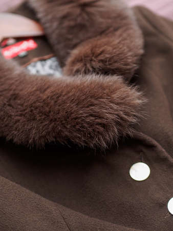 Close up of fashionable mens brown coat combined with brown fashionable sweater. Low DOF.の写真素材