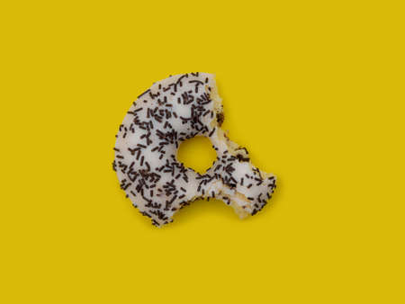 Colorful delicious donut in a row, bittenの写真素材