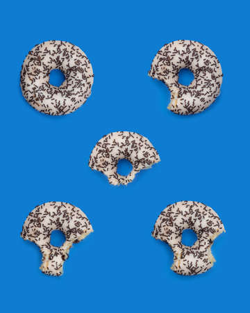 Donuts with icing on a pastel blue background. Sweet donuts.の写真素材